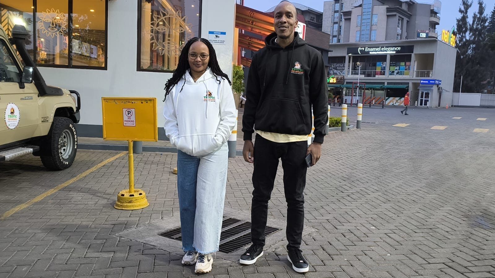Tropic Adventures team members in branded hoodies