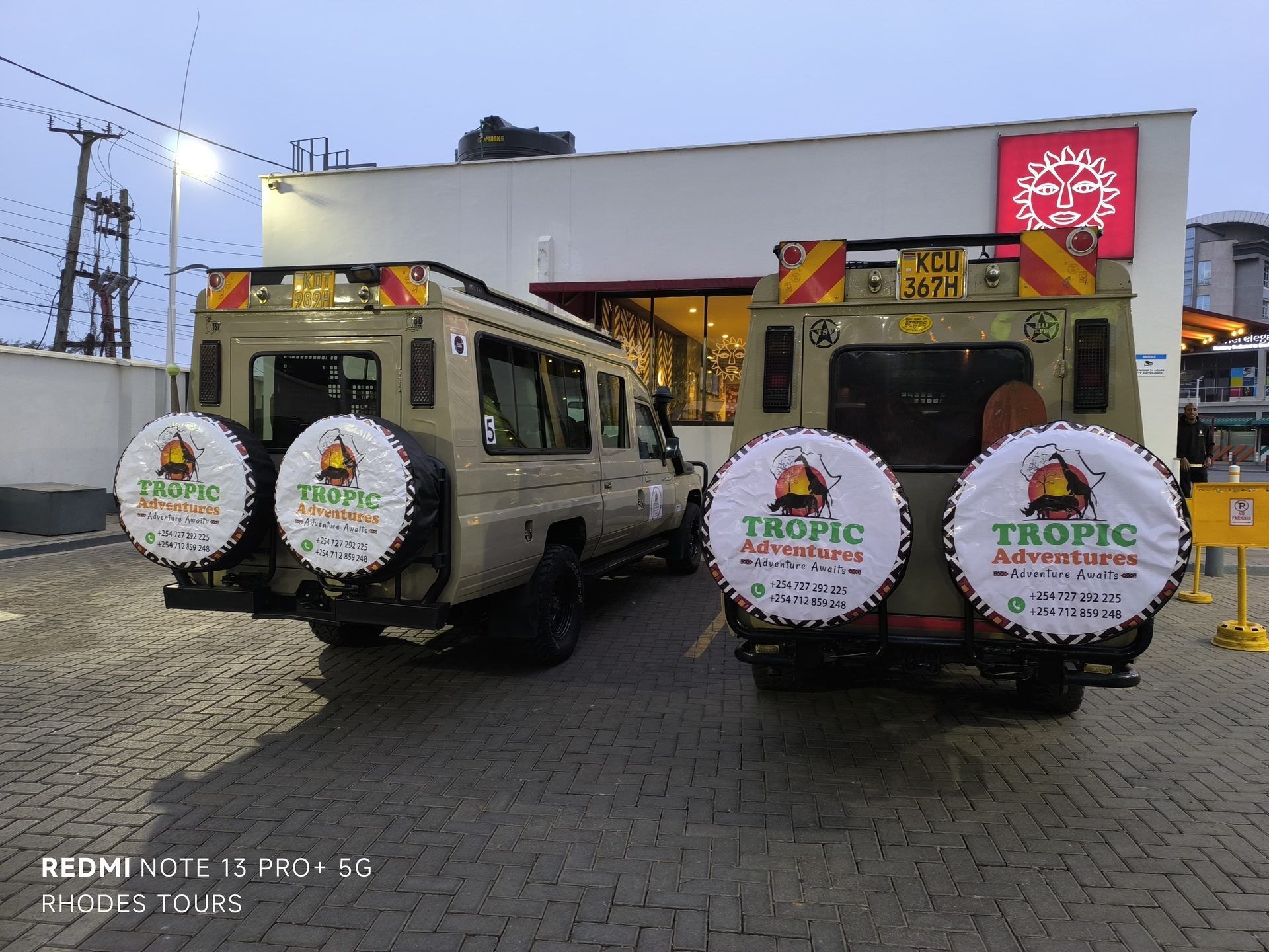 Two Tropic Adventures safari vehicles parked and ready