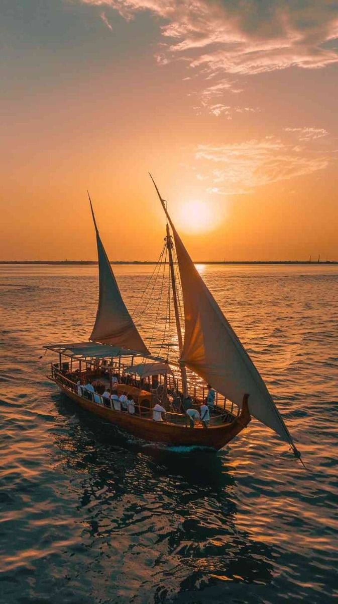 Traditional dhow sailing at sunset on the East African coast